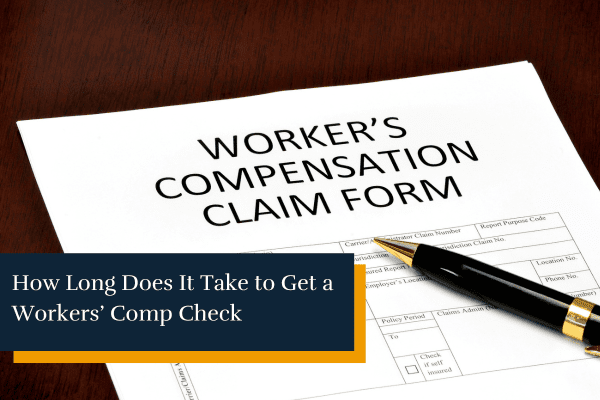 workers' compensation claim form and a pen on a table